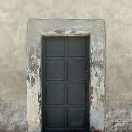 Lime wall wooden door texture