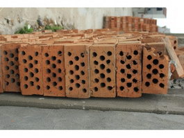 A heap of clay red bricks texture