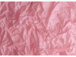Pink sheet of crumpled paper texture