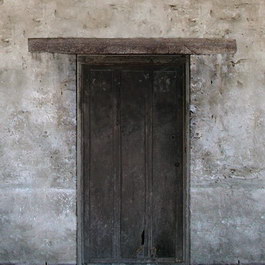 Old lime walls and wooden door texture