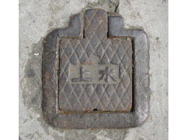 Ancient cast iron sewer cover texture