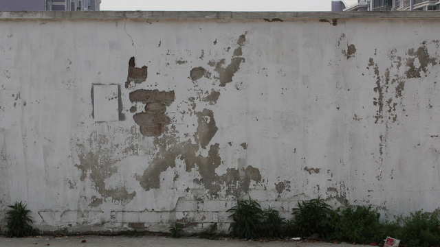 Peeling of the whitewashed wall texture