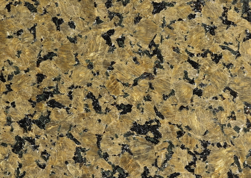 Closeup of golden diamond granite slab texture