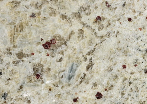 Close-up of Venetian gold granite slab surface texture
