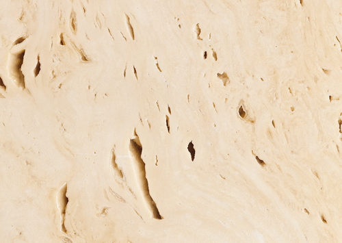 Close-up of beige travertine limestone texture