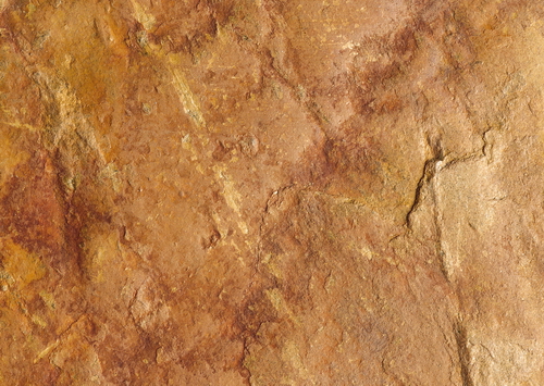 Yellow slate rock surface texture