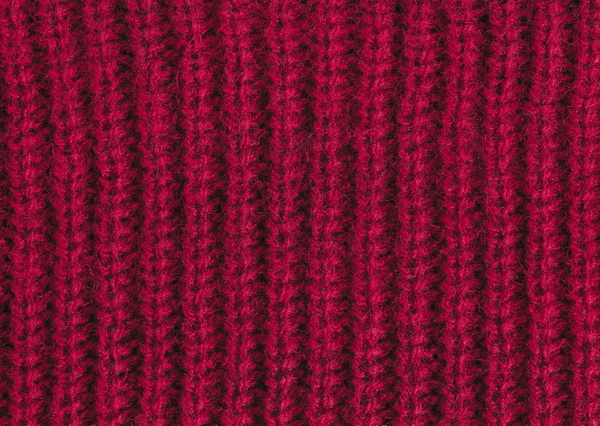 Maroon wool knitted background colseup texture
